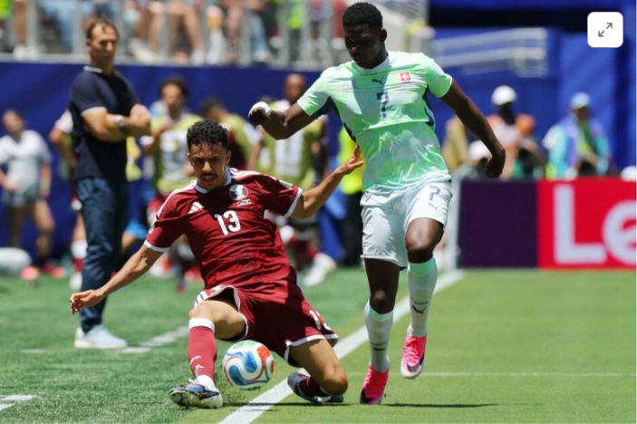 Qatar score late to clinch draw with stunned Switzerland 